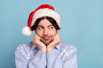 Photo of positive dreamy happy man look empty space imagine present christmas isolated on blue color background