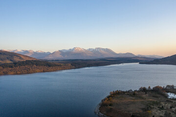Fototapeta na wymiar Scottish Loch and Mountain Landscape at Sunset