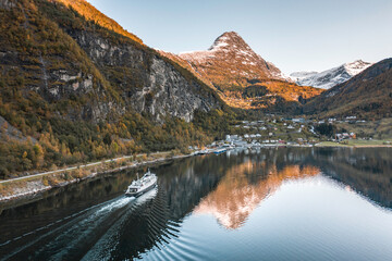 A Ferry Carrying Cars and Passengers Passes Through a Norwegian Fjord