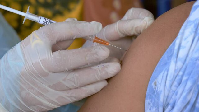 Doctor uses needle and syringe to put vaccine injection to people,Flu Vaccine , coronavirus, covid-19 vaccine