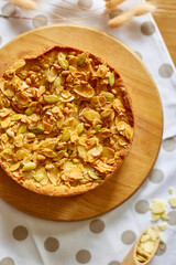 Apple or pear pie, tart with caramel nuts on wooden table, copy space, top view.