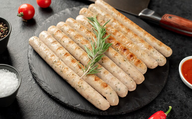 grilled bavarian sausages on a stone background