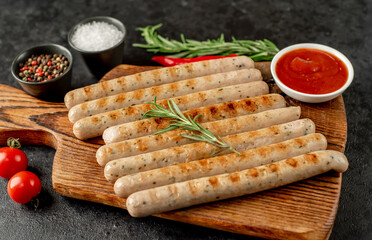 grilled bavarian sausages on a stone background