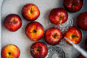 red apples in the sink