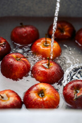 red apples in the sink