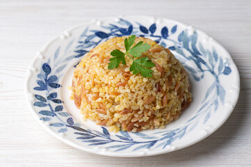 Traditional delicious Turkish food, bulgur pilaf with vermicelli (Turkish name; arpa sehriyeli bulgur pilavi)