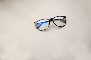 Fototapeta na wymiar black frame blue light blocking technology anti glare spectacles glasses on grey background