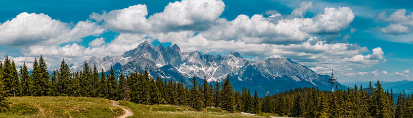 High resolution stitched panorama of a beautiful alpine summer view with the famous Dachstein summit seen from the Rossbrand summit near Filzmoos, Salzburg, Austria