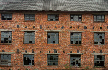 Abandoned high-rise building with broken windows
