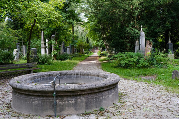 Historic antique old Südfriedhof graveyard cemetery with ancient tombstones, religious statues,...