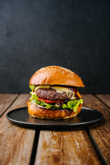 fresh tasty meat free burger on wooden table - obrazy, fototapety, plakaty