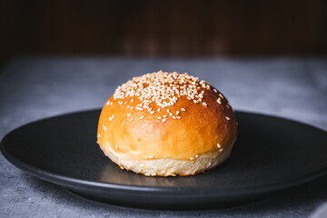 Classic burger with all ingredients on a charcoal grill