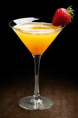 Appetizing daiquiri cocktail drink against black background.