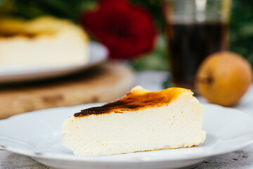 Basque burnt cheesecake served outside on white plate