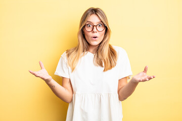blonde pretty woman open-mouthed and amazed, shocked and astonished with an unbelievable surprise