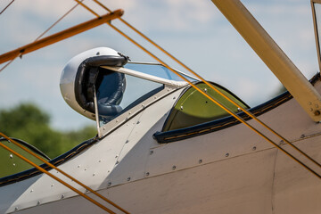 Pilot's helmet on the windshield of a classic bi-plane