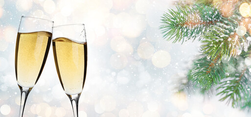 Christmas greeting card with fir tree branch and champagne