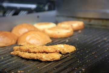 Fresh tasty burger on dark background - Hamburgers cooking on grill