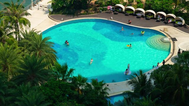 sunny day sanya famous hotel resort swimming pool rooftop panorama timelapse 4k hainan island china