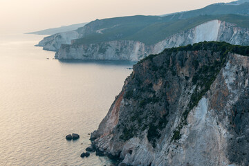 coastline with sea, mountains, canyon and cliffs with sunset light, Greece