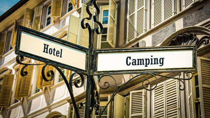 Street Sign to Camping versus Hotel