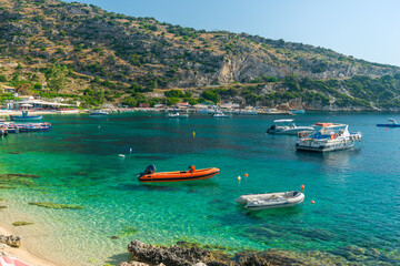 Obraz premium boats sway on the turquoise waves of the Ionian sea of Greece in sunny weather