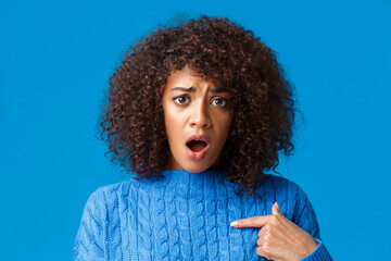Close-up portrait offended and upset silly timid african-american woman was accused or blamed,...