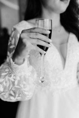 beautiful bride in white dress holding a glass of wine wedding