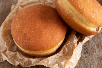 Chocolate beignets on rustic background
