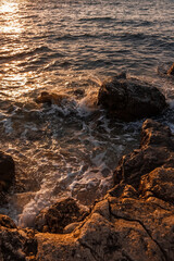Rocky seashore. Natural background. Summer evening on the beach.