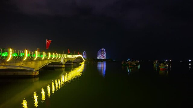 night time illuminated sanya famous hotel complex bridge bay panorama timelapse 4k hainan island china