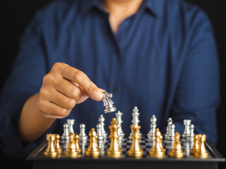 Chessboard game for ideas and competition. Businesswoman playing chess board game for development analysis new strategic planning. Strategy and business success concept