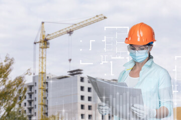 Civil engineer looking at the project on the background of the construction site.