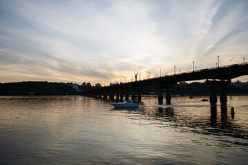 Fototapeta premium evening landscape of the city against the background of a large river