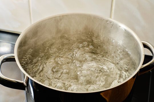 Boiling water in cooking pot