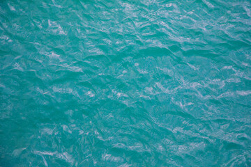 Fototapeta na wymiar Aerial view of ripple sea waves. Turquoise sea or ocean texture with waves. Water sea for background