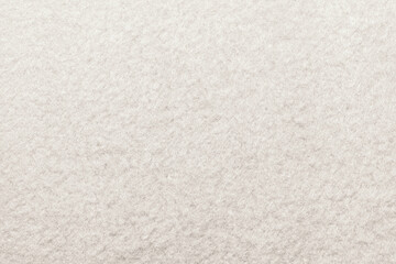 White fabric. The texture of the material is light in color. Felt. Carpet