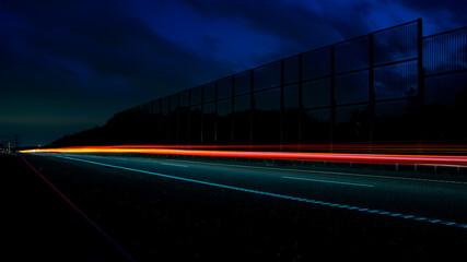 Night road lights. Lights of moving cars at night. long exposure red, blue, orange, multicolored