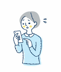 スマートフォンを見て困っている女性