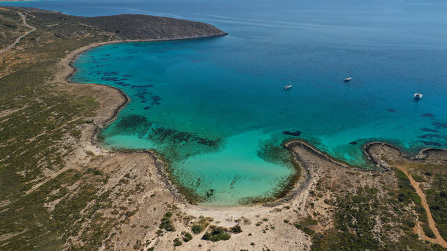 Aerial drone photo of paradise turquoise secluded sandy beach of Lefki or White in island of Elafonisos next to popular beach of Simos, South Peloponnese, Lakonia, Greece
