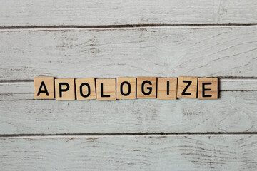 Apologize made of wooden letters - obrazy, fototapety, plakaty