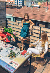 Top view of group of friends talking and drinking on a terrace