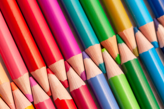 Background texture multi-colored sharpened pencils. The concept of stationery, school supplies, drawing and motor skills development in children.