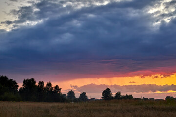 Fototapeta na wymiar Dramatic sky on summer sunset. Beautiful clouds.