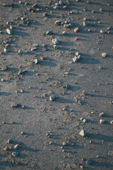 stones cast a shadow on the road