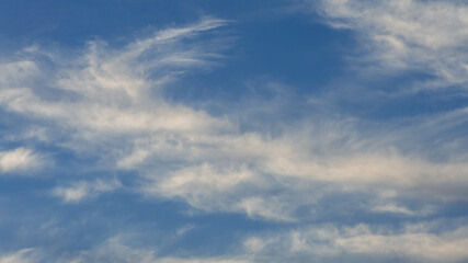Obraz premium Cumulus clouds with blue sky on a sunny day of summer. Beautiful cloudscape as nature background panorama. Wonderful weather of natural daylight with white cloud floating, creating a abstract shape