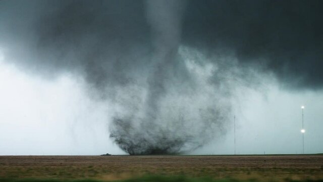 A Tornado Churns In A Field During An Outbreak Of Severe Storms