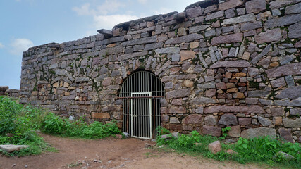 Fototapeta na wymiar Prison entrance gate in Golkonda fort, Hyderabad, Telangana, India