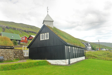 Typical Faroese wooden church standing close to the coast in Kollafj&oslash;r&eth;ur.  