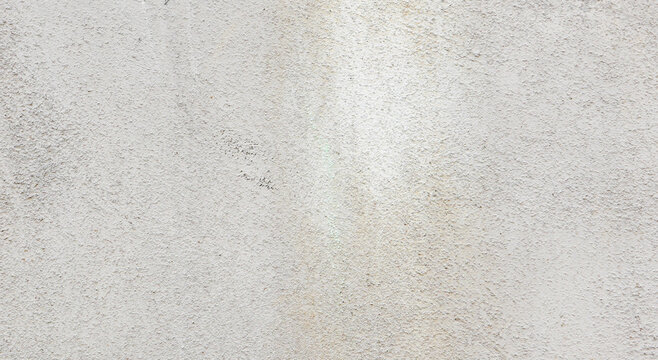 Abstract background from old shabby gray plaster on the wall close-up.